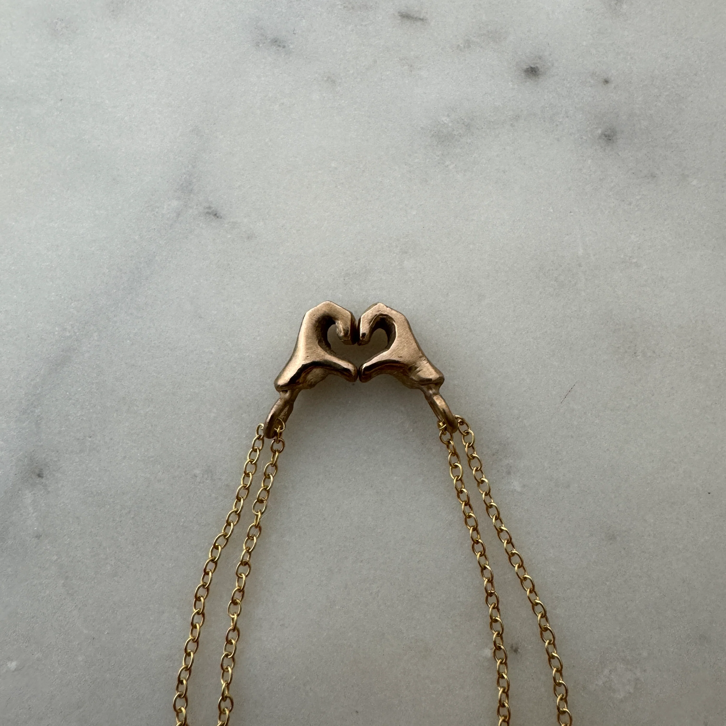 ARCHIVE — HEART HAND PENDANTS